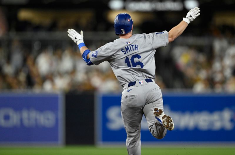 Oct 9, 2024; San Diego, California, USA; Los Angeles Dodgers catcher Will Smith (16) celebrates after hitting a two-run home run in the third inning against the San Diego Padres during game four of the NLDS for the 2024 MLB Playoffs at Petco Park.  Mandatory Credit: Denis Poroy-Imagn Images