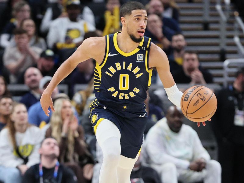 INDIANAPOLIS, INDIANA - JANUARY 03: Tyrese Haliburton #0 of the Indiana Pacers dribbles the ball during the 142-130 win against the Milwaukee Bucks at Gainbridge Fieldhouse on January 03, 2024 in Indianapolis, Indiana.    NOTE TO USER: User expressly acknowledges and agrees that, by downloading and or using this photograph, User is consenting to the terms and conditions of the Getty Images License Agreement.  (Photo by Andy Lyons/Getty Images)