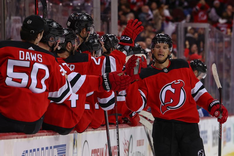 Feb 6, 2024; Newark, New Jersey, USA; New Jersey Devils defenseman John Marino (6) celebrates his goal against the Colorado Avalanche during the third period at Prudential Center. Mandatory Credit: Ed Mulholland-USA TODAY Sports