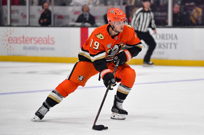 Nov 28, 2025; Anaheim, California, USA; Anaheim Ducks right wing Troy Terry (19) controls the puck against the Los Angeles Kings during the second period at Honda Center. Mandatory Credit: Gary A. Vasquez-Imagn Images