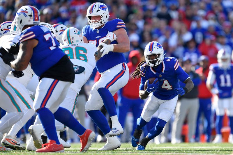 Buffalo Bills running back James Cook (4) runs during the first half of an NFL football game against the Miami Dolphins, Sunday, Nov. 3, 2024, in Orchard Park, N.Y. (AP Photo/Adrian Kraus)