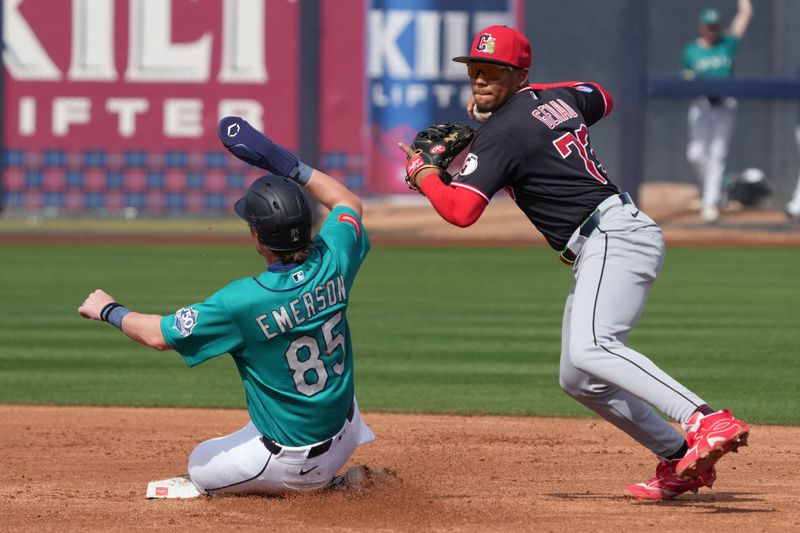 Feb 26, 2026; Peoria, Arizona, USA; Cleveland Guardians third baseman Angel Genao (73) gets the force out against Seattle Mariners shortstop Colt Emerson (85) in the second inning at Peoria Sports Complex. Mandatory Credit: Rick Scuteri-Imagn Images