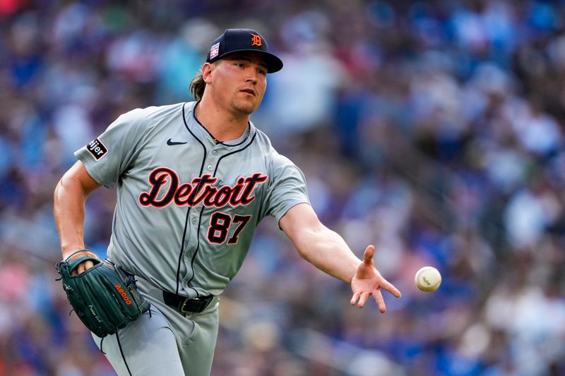 Jul 20, 2024; Toronto, Ontario, CAN; Detroit Tigers pitcher Tyler Holton (87) throws to first base against the Toronto Blue Jays during the seventh inning at Rogers Centre. Mandatory Credit: Kevin Sousa-USA TODAY Sports