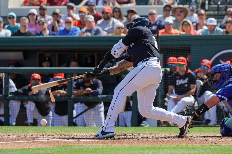 Mar 3, 2025; Lakeland, Florida, USA; Detroit Tigers shortstop Javier Baez (28) breaks a bat during the second inning against the Toronto Blue Jays at Publix Field at Joker Marchant Stadium. Mandatory Credit: Mike Watters-Imagn Images