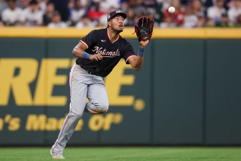 May 14, 2025; Atlanta, Georgia, USA; Washington Nationals left fielder James Wood (29) catches a fly ball against the Atlanta Braves in the eighth inning at Truist Park. Mandatory Credit: Brett Davis-Imagn Images