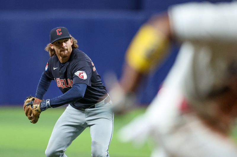 Jul 12, 2024; St. Petersburg, Florida, USA; Cleveland Guardians shortstop Daniel Schneemann (10) throws out Tampa Bay Rays first baseman Yandy Diaz (2) at home in the fifth inning at Tropicana Field. Mandatory Credit: Nathan Ray Seebeck-USA TODAY Sports