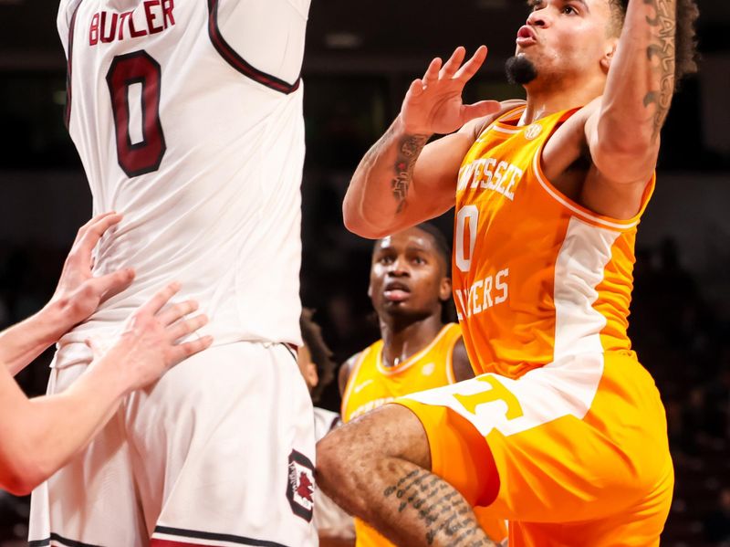 Mar 3, 2026; Columbia, South Carolina, USA; Tennessee Volunteers guard Ja'kobi Gillespie (0) attempts to shoot over South Carolina Gamecocks forward Jordan Butler (0) in the second half at Colonial Life Arena. Mandatory Credit: Jeff Blake-Imagn Images