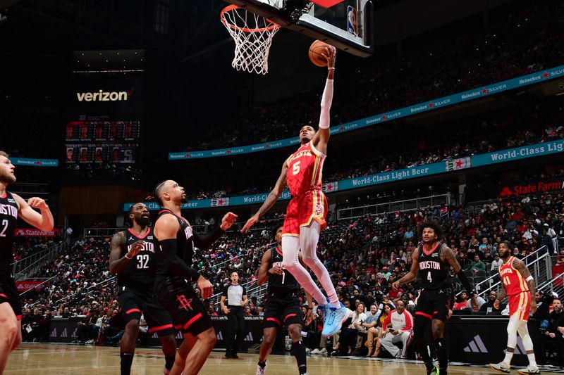 ATLANTA, GA - FEBRUARY 10: Dejounte Murray #5 of the Atlanta Hawks drives to the basket during the game against the Houston Rockets on February 10, 2024 at State Farm Arena in Atlanta, Georgia.  NOTE TO USER: User expressly acknowledges and agrees that, by downloading and/or using this Photograph, user is consenting to the terms and conditions of the Getty Images License Agreement. Mandatory Copyright Notice: Copyright 2024 NBAE (Photo by Scott Cunningham/NBAE via Getty Images)