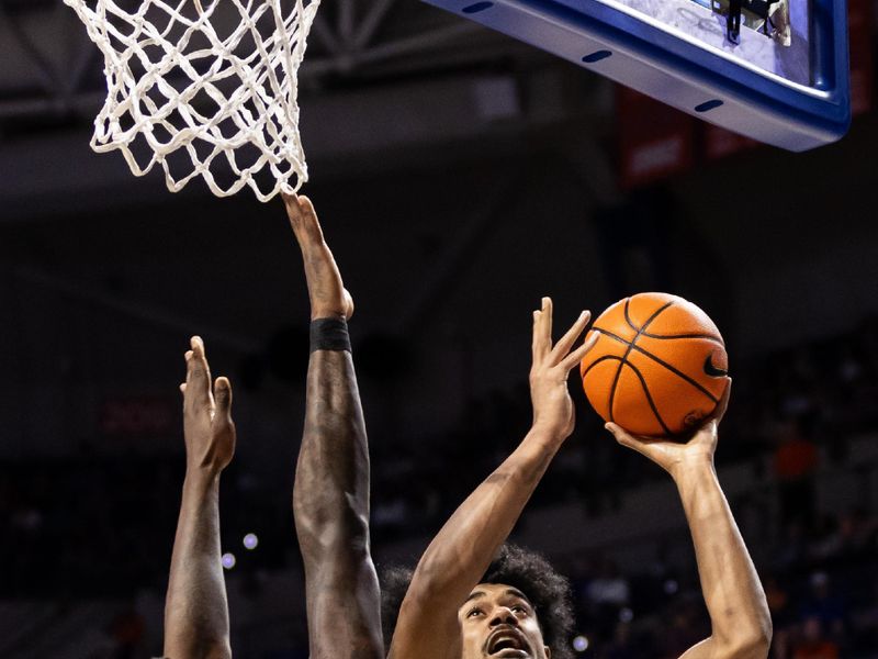 Jan 24, 2024; Gainesville, Florida, USA; Mississippi State Bulldogs forward Tolu Smith (1) shoots over Florida Gators forward Tyrese Samuel (4) during the first half at Exactech Arena at the Stephen C. O'Connell Center. Mandatory Credit: Matt Pendleton-USA TODAY Sports