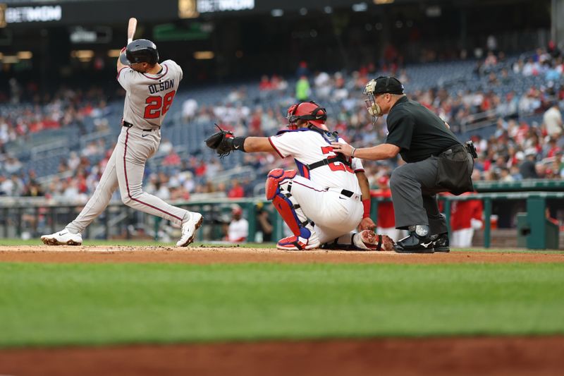 May 20, 2025; Washington, District of Columbia, USA; Atlanta Braves first base Matt Olson (28) hits a solo home run against the Washington Nationals during the second inning at Nationals Park. Mandatory Credit: Geoff Burke-Imagn Images