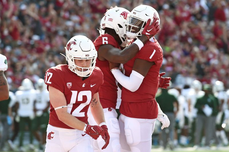 Sep 17, 2022; Pullman, Washington, USA; Washington State Cougars quarterback Cameron Ward (1) and Washington State Cougars wide receiver Donovan Ollie (6) celebrate a score against the Colorado State Rams in the first half at Gesa Field at Martin Stadium. Mandatory Credit: James Snook-USA TODAY Sports