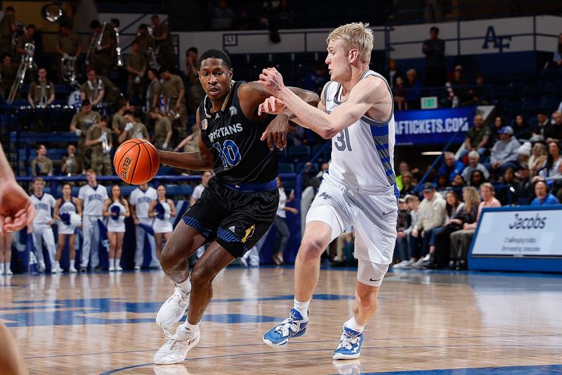 Mar 4, 2023; Colorado Springs, Colorado, USA; San Jose State Spartans guard Omari Moore (10) controls the ball as Air Force Falcons forward Rytis Petraitis (31) guards in the first half at Clune Arena. Mandatory Credit: Isaiah J. Downing-USA TODAY Sports