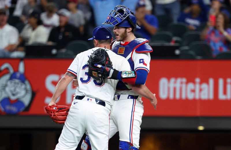 Sep 18, 2024; Arlington, Texas, USA;  Texas Rangers relief pitcher Kirby Yates (39) celebrates with Texas Rangers catcher Jonah Heim (28) after the game against the Toronto Blue Jays at Globe Life Field. Mandatory Credit: Kevin Jairaj-Imagn Images