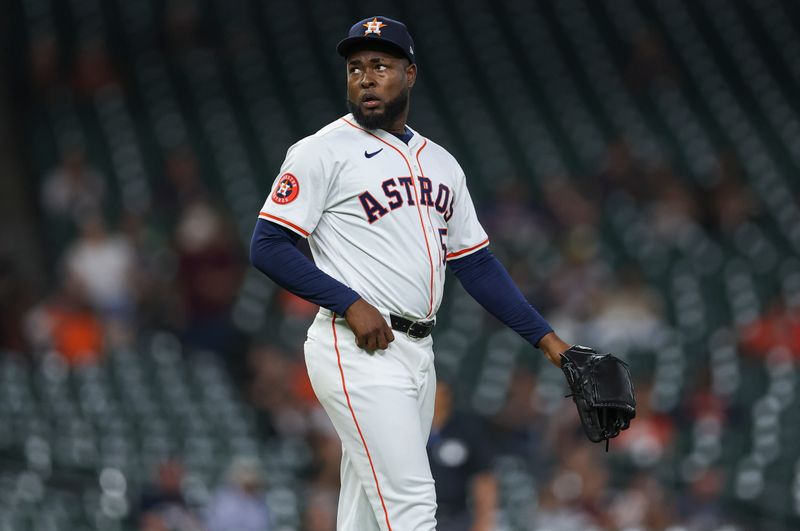 May 16, 2024; Houston, Texas, USA; Houston Astros starting pitcher Cristian Javier (53) reacts after a pitch during the first inning against the Oakland Athletics at Minute Maid Park. Mandatory Credit: Troy Taormina-USA TODAY Sports