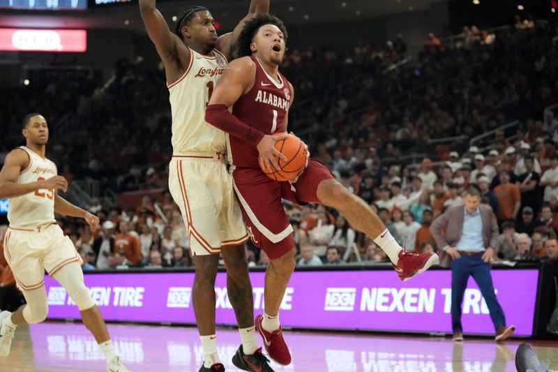 Feb 11, 2025; Austin, Texas, USA; Texas Longhorns guard Mark Sears (1) drives to the basket past Texas Longhorns guard Tramon Mark (12) during the second half at Moody Center. Mandatory Credit: Scott Wachter-Imagn Images