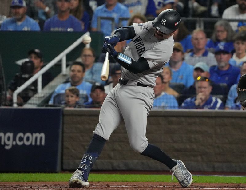 Oct 10, 2024; Kansas City, Missouri, USA; New York Yankees catcher Austin Wells (28) swings at a pitch during the first inning against the Kansas City Royals during game four of the ALDS for the 2024 MLB Playoffs at Kauffman Stadium. Mandatory Credit: Denny Medley-Imagn Images