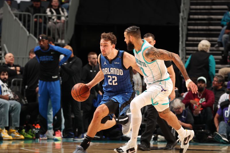 CHARLOTTE, NC - NOVEMBER 25:  Franz Wagner #22 of the Orlando Magic dribbles the ball during the game against the Charlotte Hornets during a regular season game on November 25, 2024 at Spectrum Center in Charlotte, North Carolina. NOTE TO USER: User expressly acknowledges and agrees that, by downloading and or using this photograph, User is consenting to the terms and conditions of the Getty Images License Agreement. Mandatory Copyright Notice: Copyright 2024 NBAE (Photo by Kent Smith/NBAE via Getty Images)