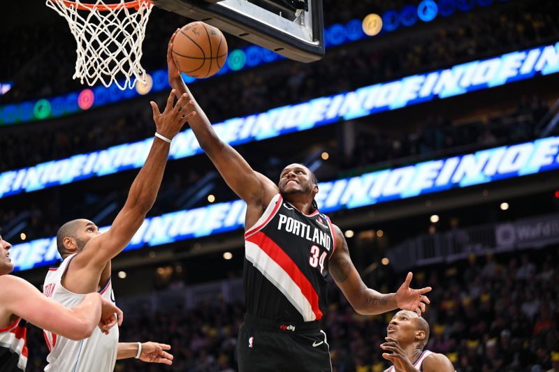 SEATTLE, WASHINGTON - OCTOBER 11: Jabari Walker #34 of the Portland Trail Blazers grabs a rebound during the first quarter of the Rain City Showcase game against the LA Clippers at Climate Pledge Arena on October 11, 2024 in Seattle, Washington. The LA Clippers won 101-99. NOTE TO USER: User expressly acknowledges and agrees that, by downloading and or using this photograph, User is consenting to the terms and conditions of the Getty Images License Agreement. (Photo by Alika Jenner/Getty Images)