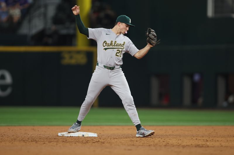 Aug 30, 2024; Arlington, Texas, USA; Oakland Athletics second baseman Zack Gelof (20) makes a force out in the sixth inning against the Texas Rangers at Globe Life Field. Mandatory Credit: Tim Heitman-USA TODAY Sports