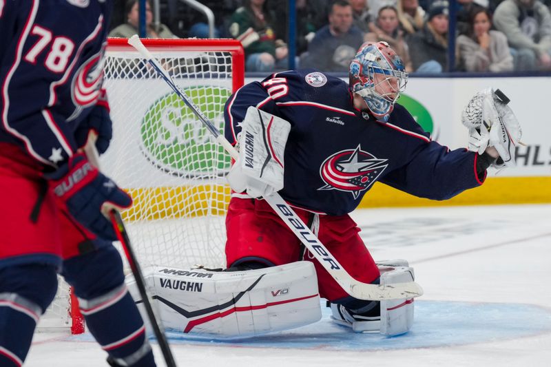 Jan 6, 2024; Columbus, Ohio, USA;  Columbus Blue Jackets goaltender Daniil Tarasov (40) attempts a glove save in net against the Minnesota Wild in the second period at Nationwide Arena. Mandatory Credit: Aaron Doster-USA TODAY Sports