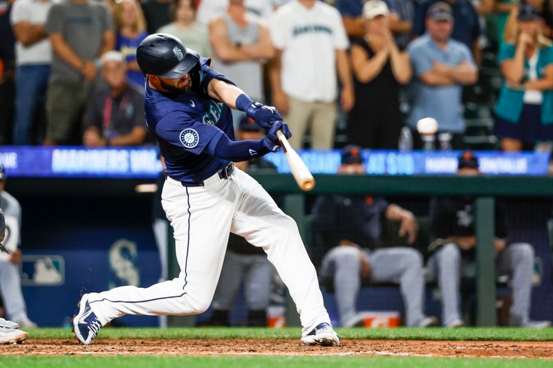 Aug 8, 2024; Seattle, Washington, USA; Seattle Mariners right fielder Mitch Haniger (17) hits a walk-off three-run double against the Detroit Tigers during the ninth inning at T-Mobile Park. Mandatory Credit: Joe Nicholson-USA TODAY Sports