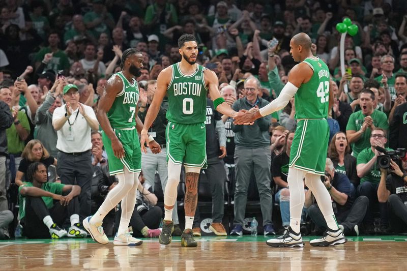 BOSTON, MA - JUNE 17: Jayson Tatum #0 of the Boston Celtics high fives Al Horford #42 of the Boston Celtics during the game against the Dallas Mavericks during Game 5 of the 2024 NBA Finals on June 17, 2024 at the TD Garden in Boston, Massachusetts. NOTE TO USER: User expressly acknowledges and agrees that, by downloading and or using this photograph, User is consenting to the terms and conditions of the Getty Images License Agreement. Mandatory Copyright Notice: Copyright 2024 NBAE  (Photo by Jesse D. Garrabrant/NBAE via Getty Images)