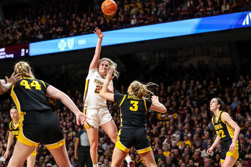 Feb 28, 2024; Minneapolis, Minnesota, USA; Minnesota Golden Gophers forward Mallory Heyer (24) shoots as Iowa Hawkeyes guard Sydney Affolter (3) defends during the first half at Williams Arena. Mandatory Credit: Matt Krohn-USA TODAY Sports