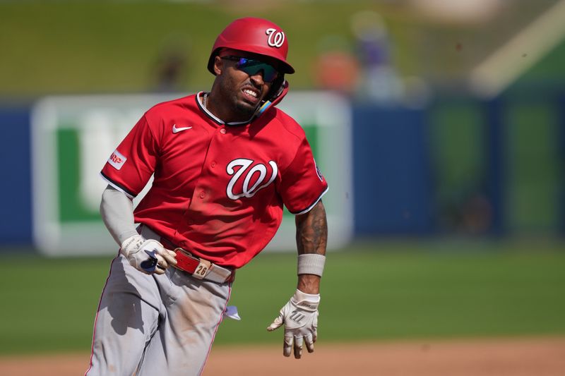 Mar 2, 2026; West Palm Beach, Florida, USA;  Washington Nationals shortstop Nasim NuÒez (26) rounds third base and scores a run after a double by third baseman Brady House in the fifth inning against the Houston Astros at CACTI Park of the Palm Beaches. Mandatory Credit: Jim Rassol-Imagn Images