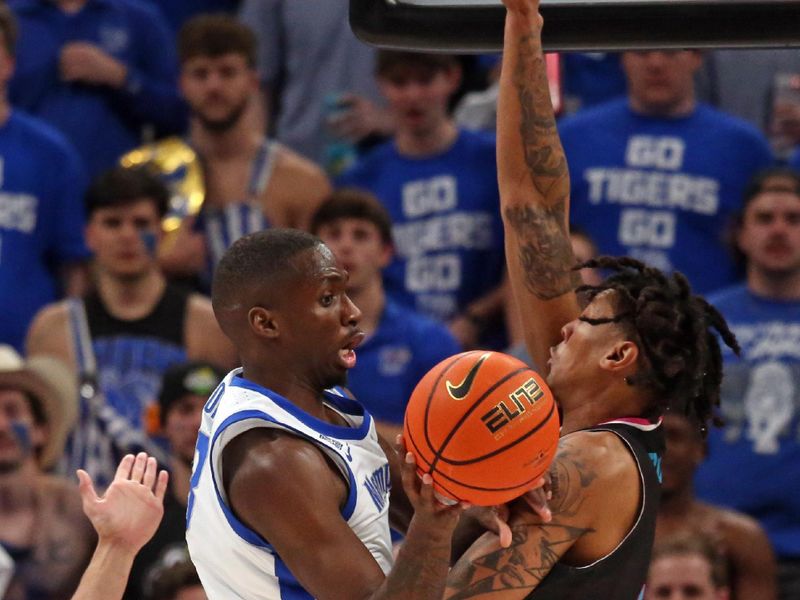 Feb 25, 2024; Memphis, Tennessee, USA; Memphis Tigers forward David Jones (8) passes the ball as Florida Atlantic Owls forward Giancarlo Rosado (3) defends during the second half at FedExForum. Mandatory Credit: Petre Thomas-USA TODAY Sports