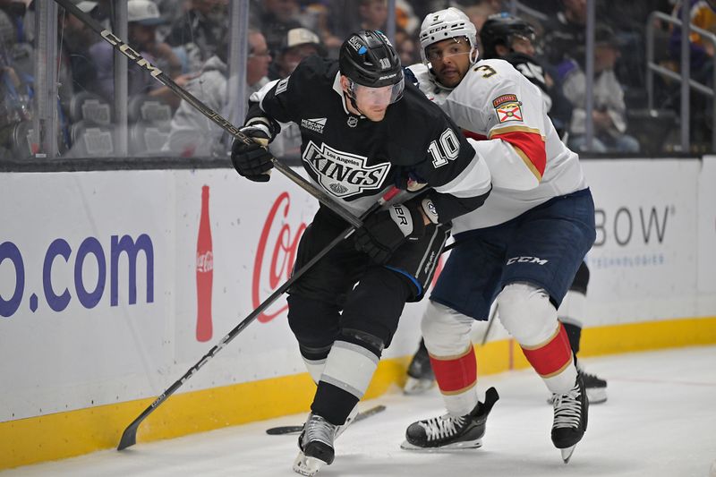 Nov 6, 2025; Los Angeles, California, USA; Los Angeles Kings right wing Corey Perry (10) and Florida Panthers defenseman Seth Jones (3) fight for position on the ice during the second period at Crypto.com Arena. Mandatory Credit: Jayne Kamin-Oncea-Imagn Images