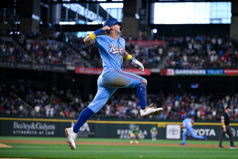 Sep 1, 2024; Arlington, Texas, USA; Texas Rangers third baseman Josh Jung (6) celebrates after he hits a game winning three run walk-off home run during the tenth inning against the Oakland Athletics at Globe Life Field. Mandatory Credit: Jerome Miron-USA TODAY Sports