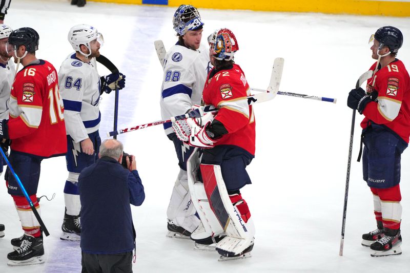 Apr 29, 2024; Sunrise, Florida, USA; Tampa Bay Lightning goaltender Andrei Vasilevskiy (88) congratulates Florida Panthers goaltender Sergei Bobrovsky (72) following game five of the first round of the 2024 Stanley Cup Playoffs at Amerant Bank Arena. The Panthers advance to the second round. Mandatory Credit: Jim Rassol-USA TODAY Sports