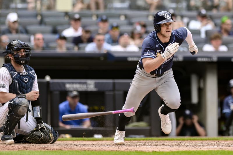 Jul 21, 2024; Bronx, New York, USA; Tampa Bay Rays shortstop Taylor Walls (6) hits a double against the New York Yankees during the fourth inning at Yankee Stadium. Mandatory Credit: John Jones-USA TODAY Sports