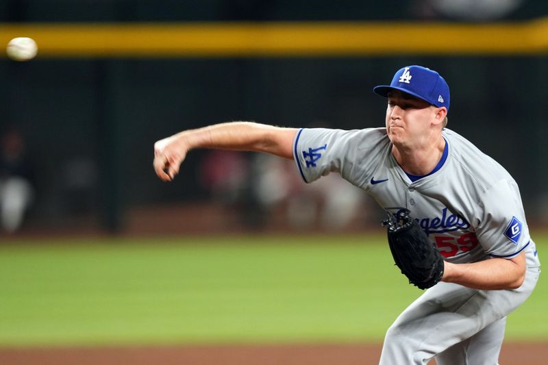 Apr 29, 2024; Phoenix, Arizona, USA; Los Angeles Dodgers pitcher Evan Phillips (59) pitches against the Arizona Diamondbacks during the ninth inning at Chase Field. Mandatory Credit: Joe Camporeale-USA TODAY Sports