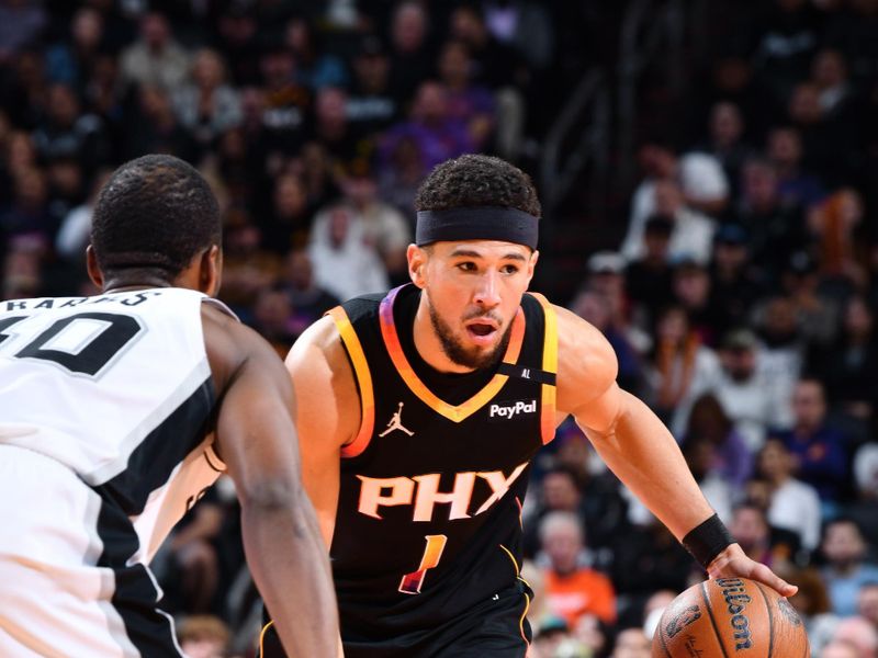 PHOENIX, AZ - DECEMBER 3: Devin Booker #1 of the Phoenix Suns looks to pass the ball during the game against the San Antonio Spurs during a Emirates NBA Cup game on December 3, 2024 at Footprint Center in Phoenix, Arizona. NOTE TO USER: User expressly acknowledges and agrees that, by downloading and or using this photograph, user is consenting to the terms and conditions of the Getty Images License Agreement. Mandatory Copyright Notice: Copyright 2024 NBAE (Photo by Barry Gossage/NBAE via Getty Images)