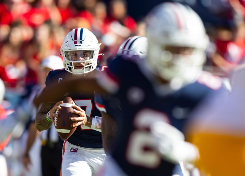 Nov 25, 2022; Tucson, Arizona, USA; Arizona Wildcats quarterback Jayden de Laura (7) against the Arizona State Sun Devils in the first half of the Territorial Cup at Arizona Stadium. Mandatory Credit: Mark J. Rebilas-USA TODAY Sports