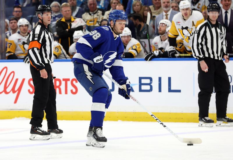 Dec 6, 2023; Tampa, Florida, USA; Tampa Bay Lightning defenseman Mikhail Sergachev (98) skates with the puck against the Pittsburgh Penguins during the first period at Amalie Arena. Mandatory Credit: Kim Klement Neitzel-USA TODAY Sports