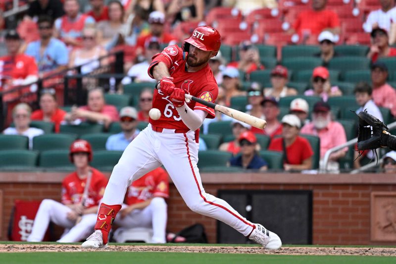 Jul 28, 2024; St. Louis, Missouri, USA; St. Louis Cardinals center fielder Michael Siani (63) hits an RBI single against the Washington Nationals during the seventh inning at Busch Stadium. Mandatory Credit: Jeff Le-USA TODAY Sports