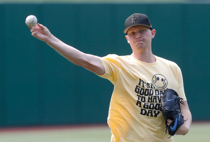 May 24, 2023; Pittsburgh, Pennsylvania, USA; Pittsburgh Pirates pitcher Mitch Keller (23) throws in the outfield before the game against the Texas Rangers at PNC Park. Mandatory Credit: Charles LeClaire-USA TODAY Sports