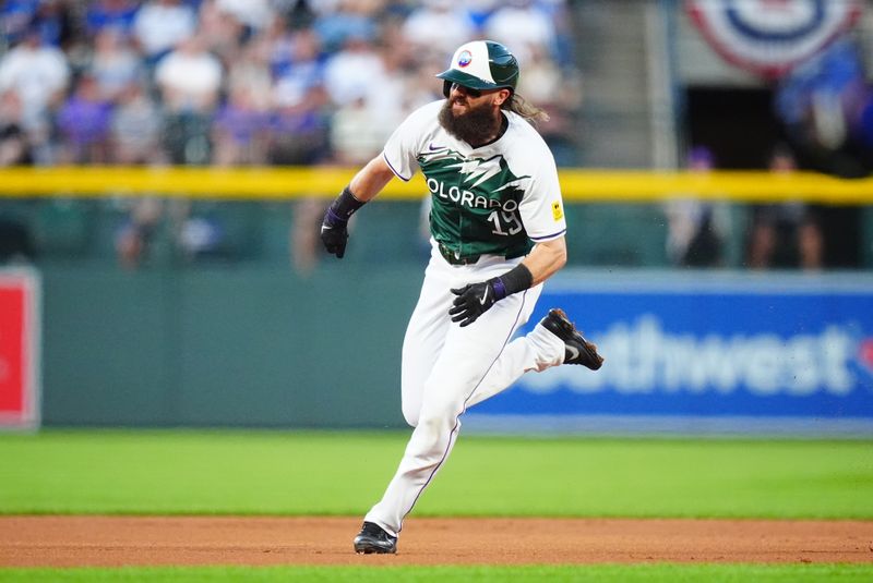 Sep 28, 2024; Denver, Colorado, USA; Colorado Rockies designated hitter Charlie Blackmon (19) runs to third in the first inning against the Los Angeles Dodgers at Coors Field. Mandatory Credit: Ron Chenoy-Imagn Images