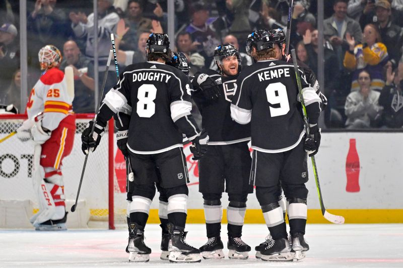 Apr 11, 2024; Los Angeles, California, USA;   Los Angeles Kings celebrate after a goal by left wing Kevin Fiala (22) in the first period against the Calgary Flames at Crypto.com Arena. Mandatory Credit: Jayne Kamin-Oncea-USA TODAY Sports