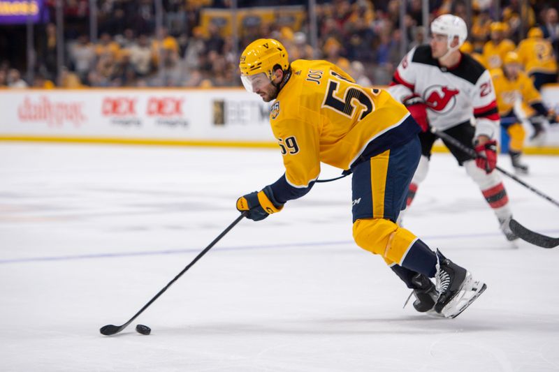 Feb 13, 2024; Nashville, Tennessee, USA;  Nashville Predators defenseman Roman Josi (59) takes a shot on goal against the New Jersey Devils during the third period at Bridgestone Arena. Mandatory Credit: Steve Roberts-USA TODAY Sports