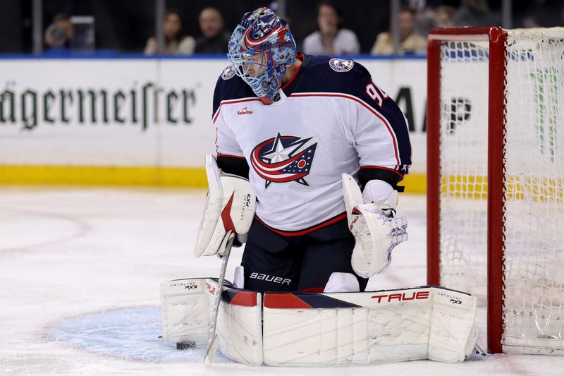 Feb 28, 2024; New York, New York, USA; Columbus Blue Jackets goaltender Elvis Merzlikins (90) makes a save against the New York Rangers during the second period at Madison Square Garden. Mandatory Credit: Brad Penner-USA TODAY Sports