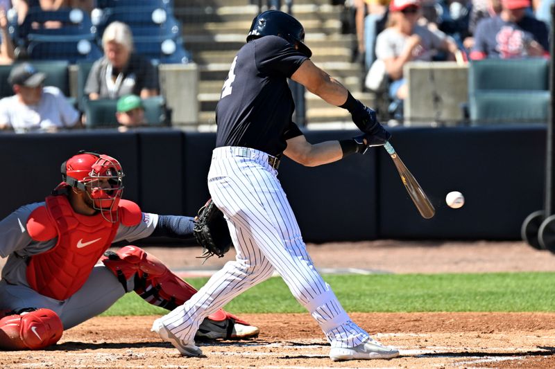 Feb 26, 2025; Tampa, Florida, USA;  New York Yankees left fielder Jasson Dominguez (24) hits a RBI single in the third inning against the St. Louis Cardinals  during spring training  at George M. Steinbrenner Field. Mandatory Credit: Jonathan Dyer-Imagn Images