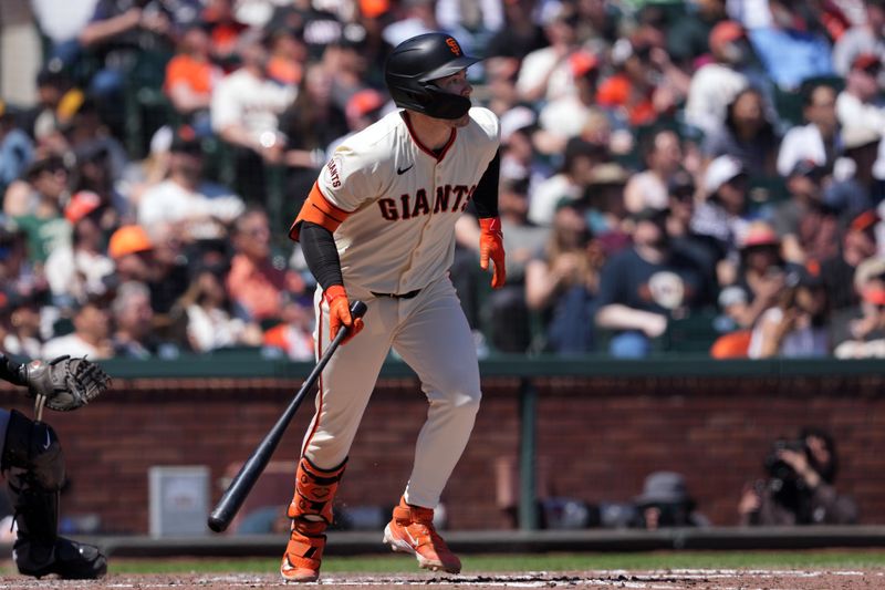 Apr 20, 2024; San Francisco, California, USA; San Francisco Giants catcher Patrick Bailey (14) hits an RBI single against the Arizona Diamondbacks during the third inning at Oracle Park. Mandatory Credit: Darren Yamashita-USA TODAY Sports