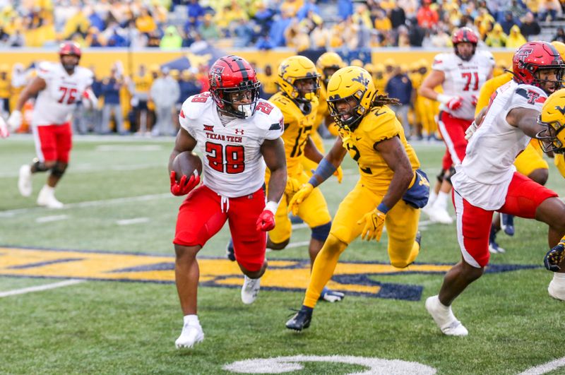 Sep 23, 2023; Morgantown, West Virginia, USA; Texas Tech Red Raiders running back Tahj Brooks (28) runs the ball against the West Virginia Mountaineers during the fourth quarter at Mountaineer Field at Milan Puskar Stadium. Mandatory Credit: Ben Queen-USA TODAY Sports