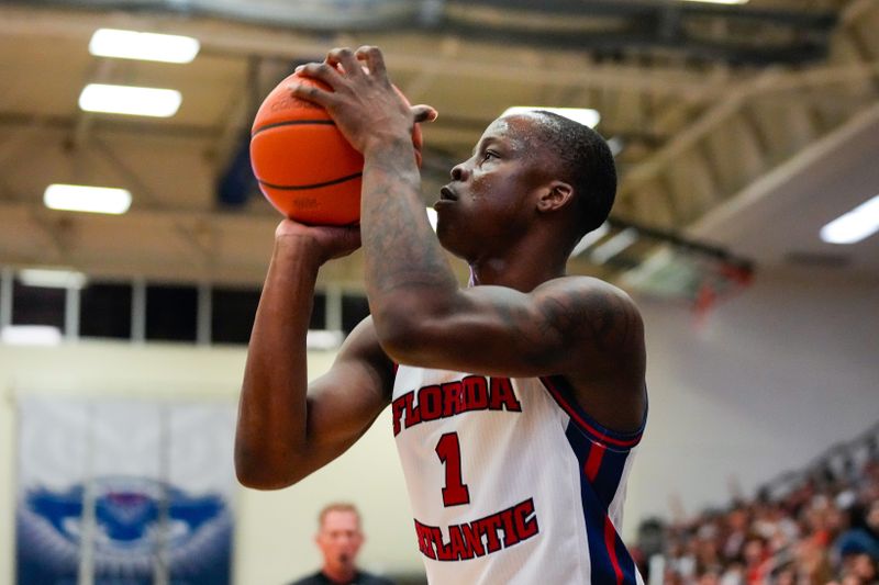 Feb 9, 2023; Boca Raton, Florida, USA; Florida Atlantic Owls guard Johnell Davis (1) shoots a three pointer against the Rice Owls during the first half at Eleanor R. Baldwin Arena. Mandatory Credit: Rich Storry-USA TODAY Sports