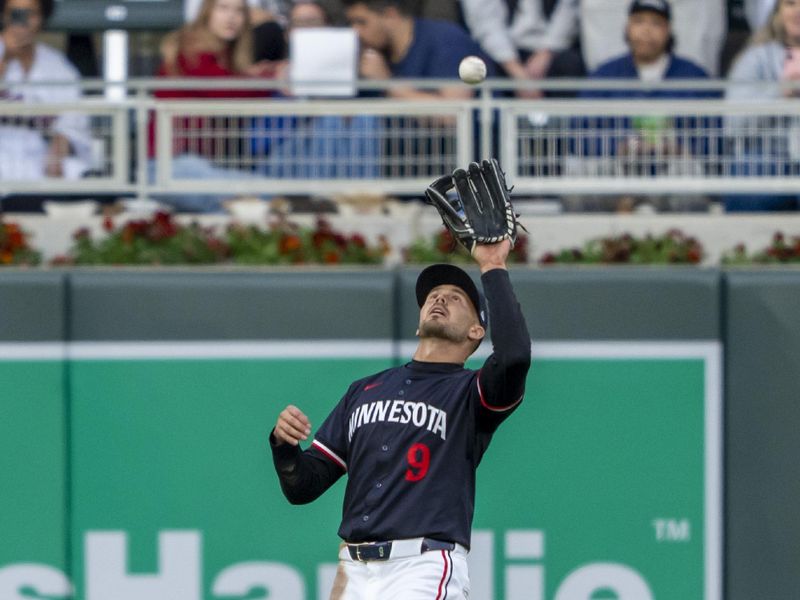 Apr 22, 2024; Minneapolis, Minnesota, USA; Minnesota Twins left fielder Trevor Larnach (9) catches a fly ball against the Chicago White Sox in the fourth inning at Target Field. Mandatory Credit: Jesse Johnson-USA TODAY Sports