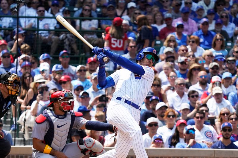 Jul 23, 2023; Chicago, Illinois, USA; Chicago Cubs center fielder Cody Bellinger (24) hits a one run sacrifice fly against the St. Louis Cardinals during the third inning at Wrigley Field. Mandatory Credit: David Banks-USA TODAY Sports