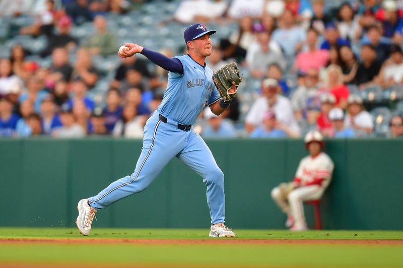 Aug 12, 2024; Anaheim, California, USA; Toronto Blue Jays second baseman Will Wagner (7) throws to first for the out against Los Angeles Angels designated hitter Willie Calhoun (5) during the second inning at Angel Stadium. Mandatory Credit: Gary A. Vasquez-USA TODAY Sports